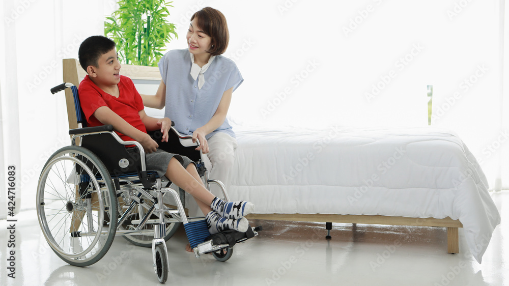 Positive multiracial nurse and child with disability chatting in hospital Positive multiracial nurse and child with disability chatting in hospital