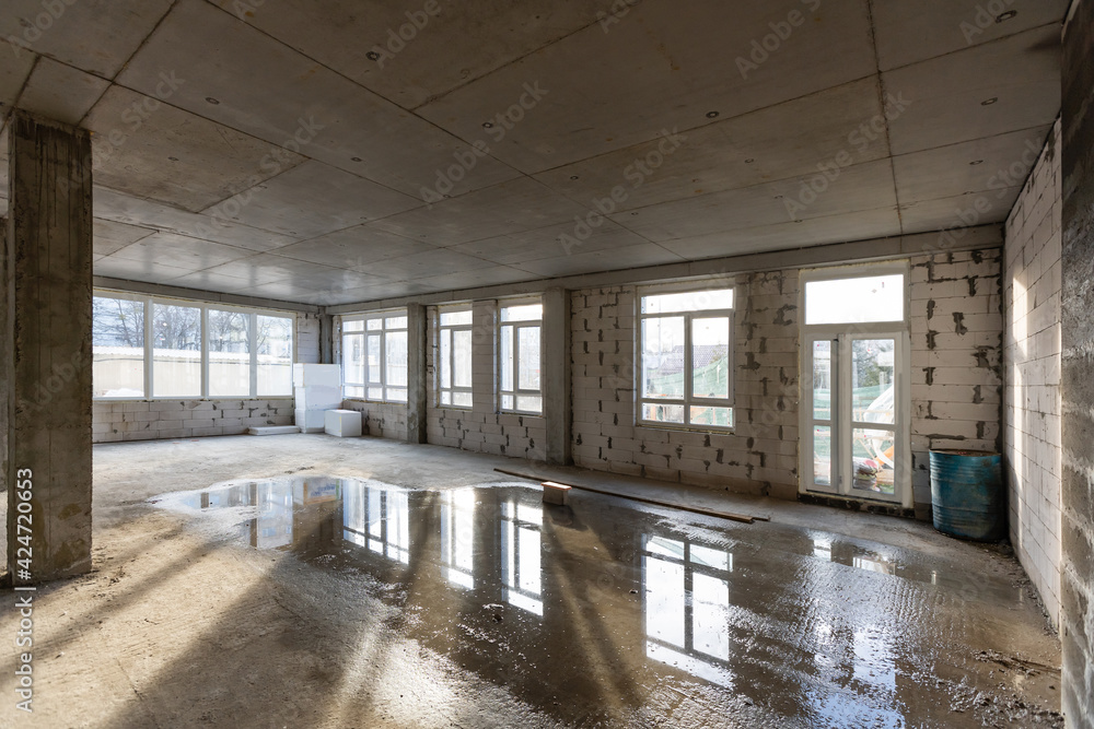 The Interior of the new room without finishing in the newly built high-rise building The Interior of the new room without finishing in the newly built high-rise building