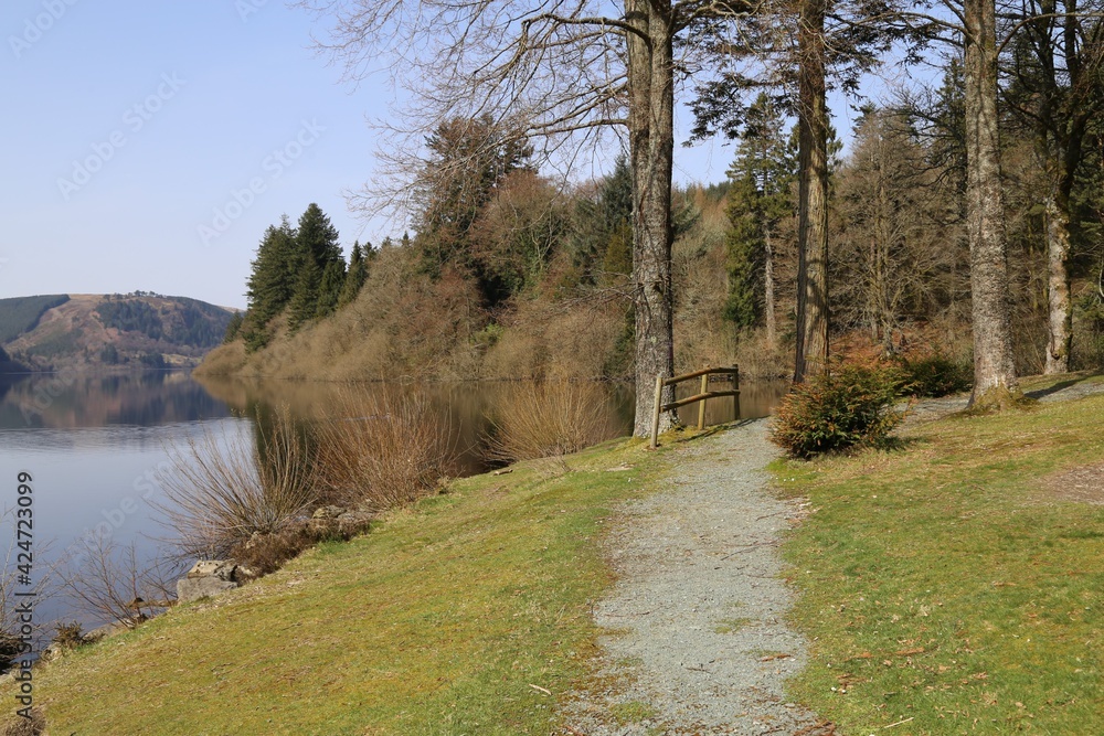 A path beside the beautiful Lake Vyrnwy in Powys, Wales, UK. A path beside the beautiful Lake Vyrnwy in Powys, Wales, UK.