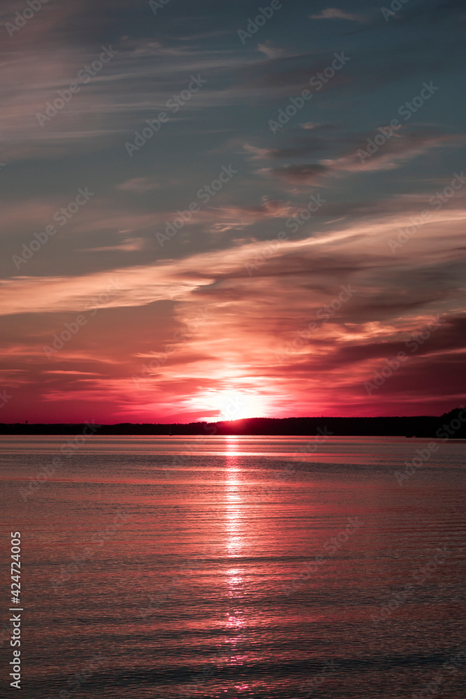 Horizontal seascape dreamy photography of a pink sunset over serenity calm sea 