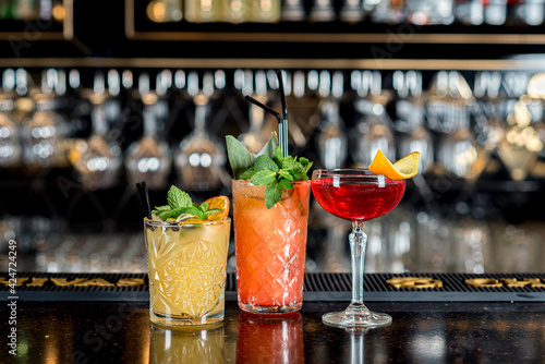 Φωτογραφία Three cocktails on the bar in different glasses