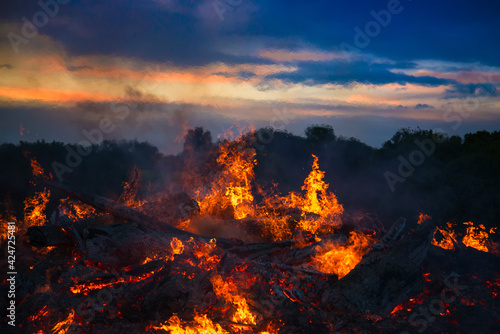 landscape with bonfire, night and bright hot flame