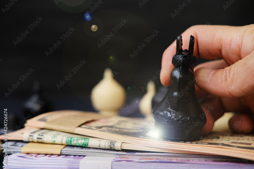 Hand holding chess board, Businessman play with Chess game and business growth concept, Creative new idea, Management or leadership concept