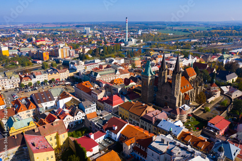 Aerial view of medieval Gothic Cathedral of St. Bartholomew on background with Kolin cityscape on sunny autumn day, Czech Republic .. photo