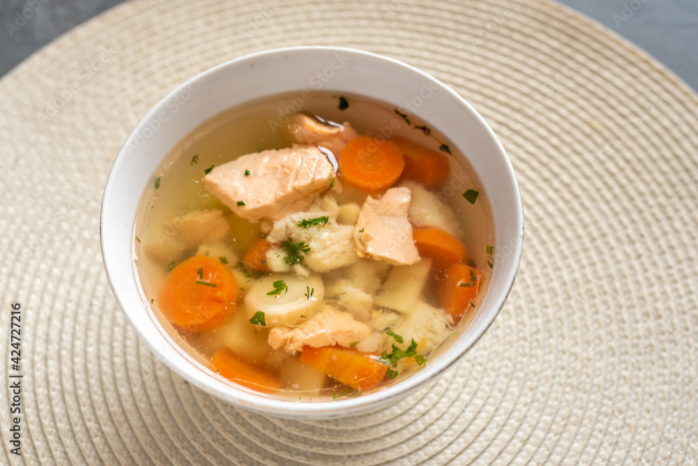 Fish soup with pieces of salmon and cod with vegetables Fish soup with pieces of salmon and cod with vegetables
