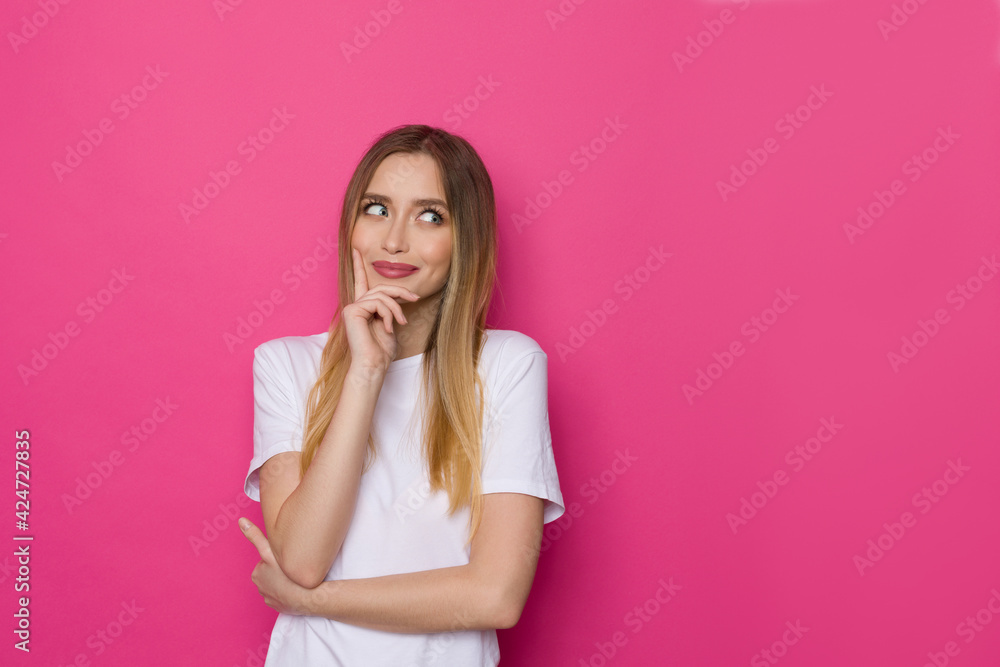 Cute Young Woman In White Shirt Is Looking Away Thinking Cute Young Woman In White Shirt Is Looking Away Thinking
