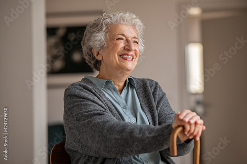 Happy smiling senior woman relaxing at home photo