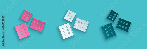 Paper cut Cracker biscuit icon isolated on blue background. Sweet cookie. Paper art style. Vector Illustration