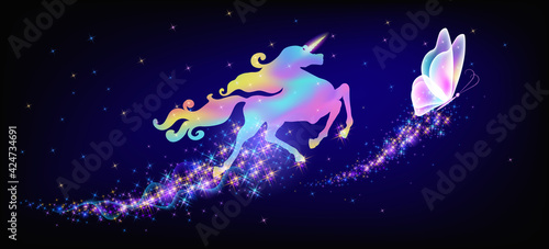 Galloping iridescent unicorn with luxurious winding mane and flying magic butterfly against the background of the fantasy universe with sparkling stars.