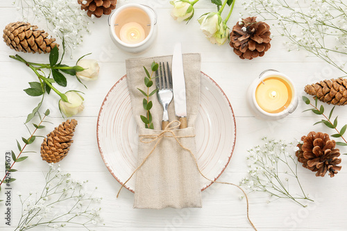 Beautiful table setting on white wooden background