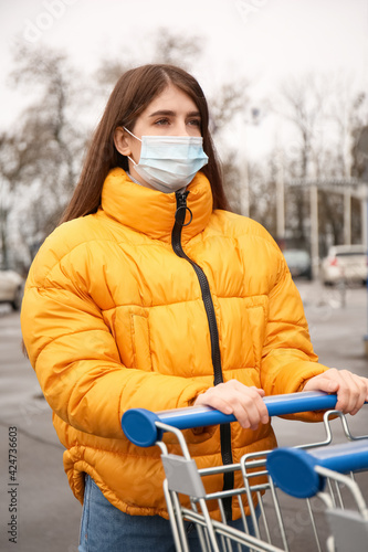 Young woman in medical mask...
