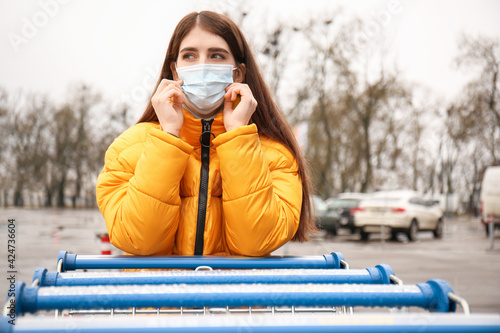 Young woman in medical mask...