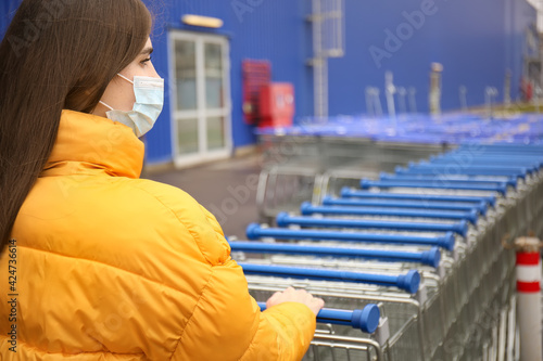 Young woman in medical mask...