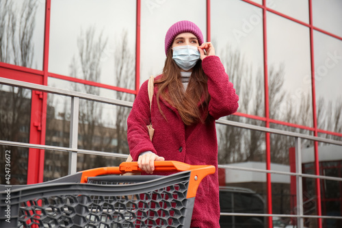 Young woman in medical mask...