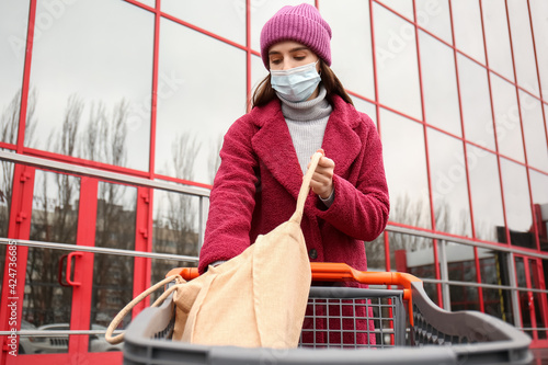 Young woman in medical mask...
