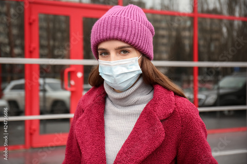 Young woman in medical mask...