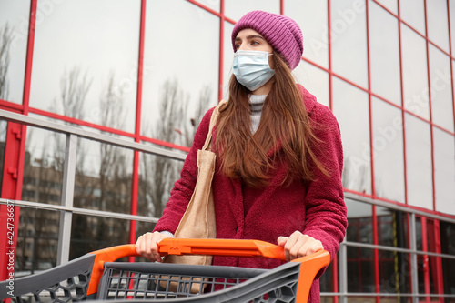 Young woman in medical mask...