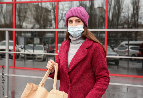 Young woman in medical mask...