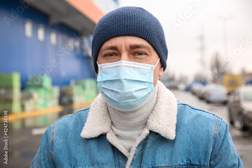 Mature man in medical mask ...