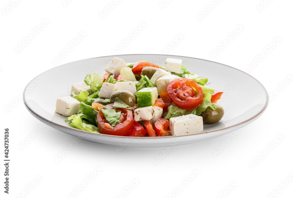 Plate with fresh Greek salad on white background