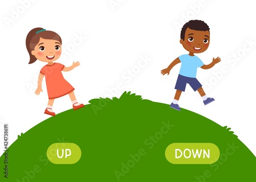 Opposites concept, UP and DOWN. Word card for English language learning. Little  European girl goes up the hill, African boy goes down. Flashcard with antonyms for children. .