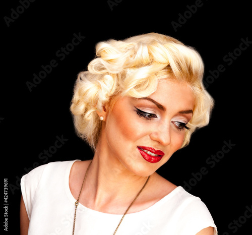 Pretty blond girl model like Marilyn Monroe in white dress with red lips photo