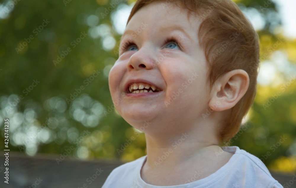 Cute Redhead Boy in a Playground Cute Redhead Boy in a Playground