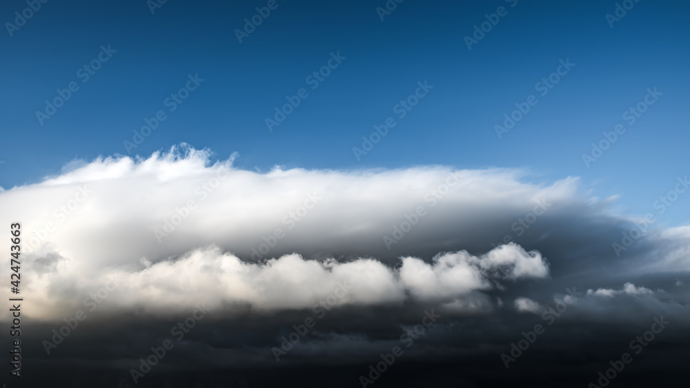 Sky with clouds and a dark thundercloud is approaching storm Sky with clouds and a dark thundercloud is approaching storm