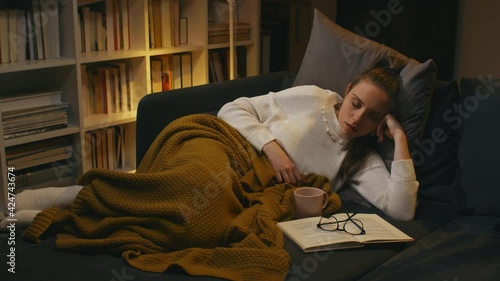 woman fell asleep while reading the book