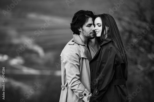 Beautiful sensual portrait of young stylish couple in love. Image of adorable brunette couple in love. Happy family.