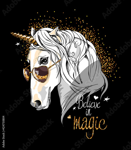 Vector illustration. White Unicorn with a golden sparkle horn and in a sunglasses on a black background. Believe in magic - lettering quote. Poster, t-shirt composition, hand drawn style print.