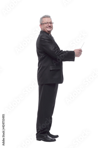 Side view of cheerful businessman touching digital tablet