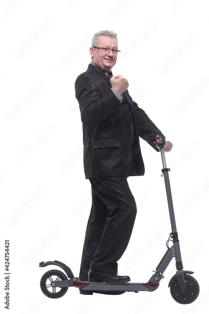 Side view of a man wearing suit with scooter Side view of a man wearing suit with scooter