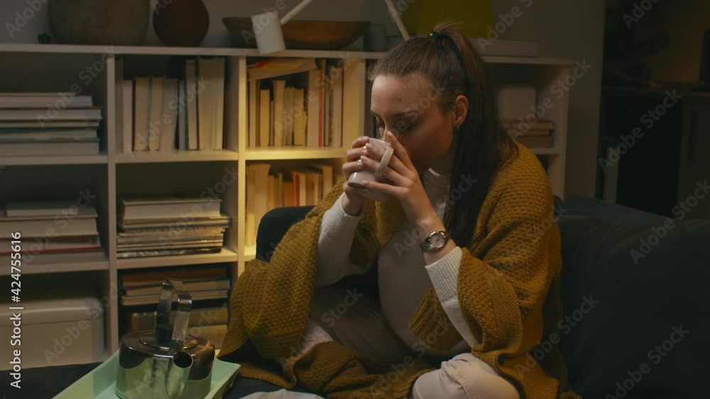 woman drinking tea. she has flu woman drinking tea. she has flu