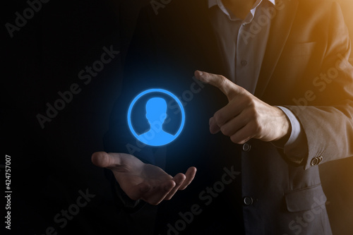 Businessman in suit holding out hand icon of user. Internet icons interface foreground. global network media concept,contact on virtual screens ,copy space