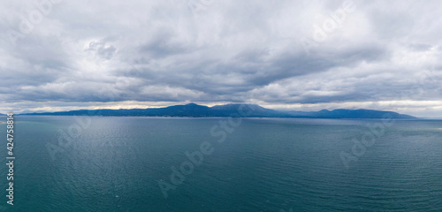 Oropos sea Gulf of Evia, Greece background. Sea and cloudy sky.