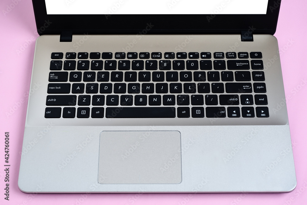 Flat Lay of minimalist silver laptop with white display for copy space Flat Lay of minimalist silver laptop with white display for copy space