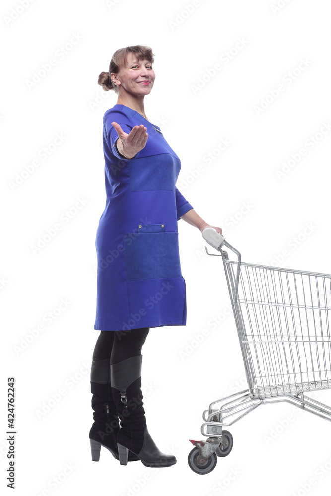 Full length portrait of a woman pushing a shopping trolley isolated on white background Full length portrait of a woman pushing a shopping trolley isolated on white background