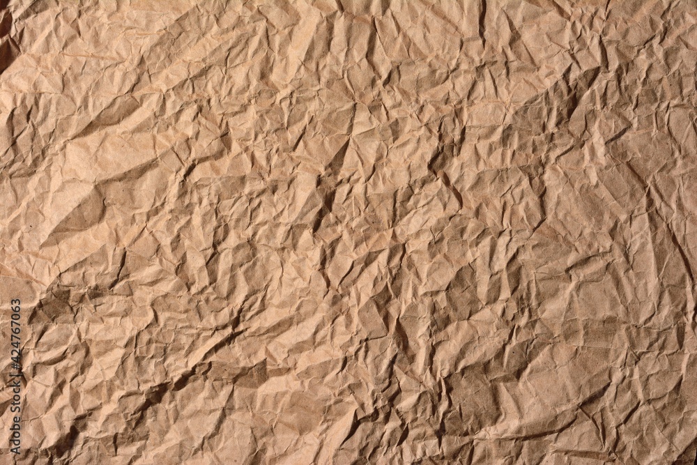 Background image of craft paper crumpled and straightened Background image of craft paper crumpled and straightened