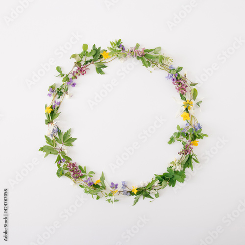 Sring creative circle with flower bloom for copy space on the white background. Minimal flat lay composition. © Jelena