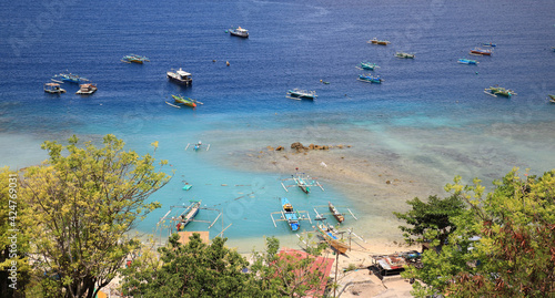 Beautiful Beach with Many Fishing Boats on Sunny Afternoon in Tanjung Kramat, Gorontalo, Indonesia