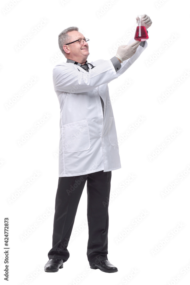Doctor holding up beaker of red chemical in the laboratory Doctor holding up beaker of red chemical in the laboratory