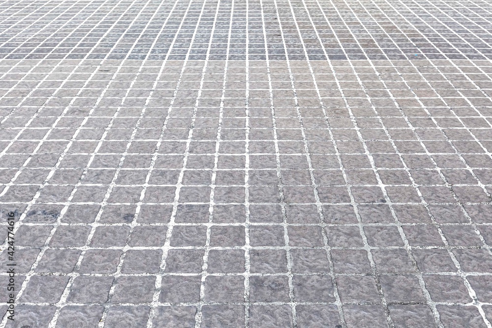 Fototapeta premium Perspective View Monotone Gray Brick Stone Pavement on The Ground for Street Road