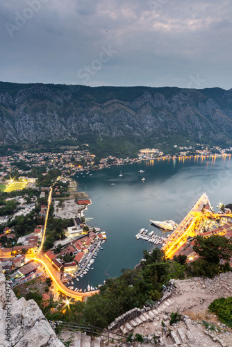 Kotor Bay and Old Town illumiinated at dusk seen from St John's Fortress and hilltop,Montenegro,Eastern Europe. photo