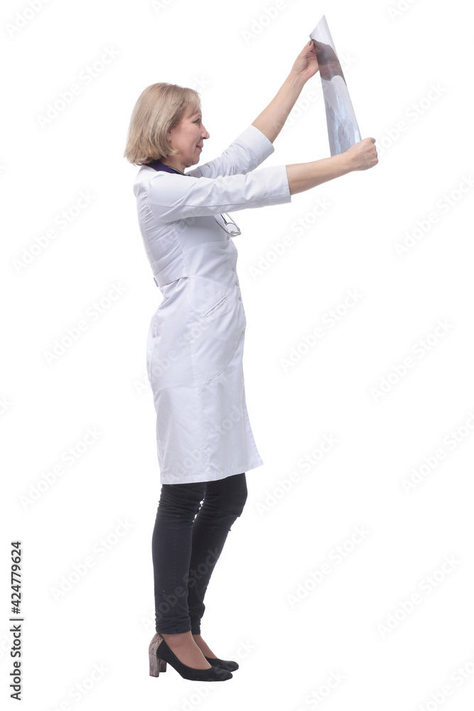 Side view of female doctor looking at x-ray Side view of female doctor looking at x-ray