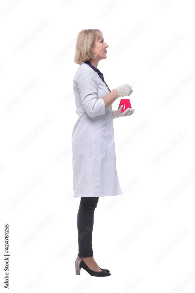 Senior chemist holding beaker with red liquid in her hand Senior chemist holding beaker with red liquid in her hand