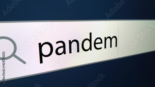Pandemic is written in the line of the Internet browser. Slow zooming on the monitor screen