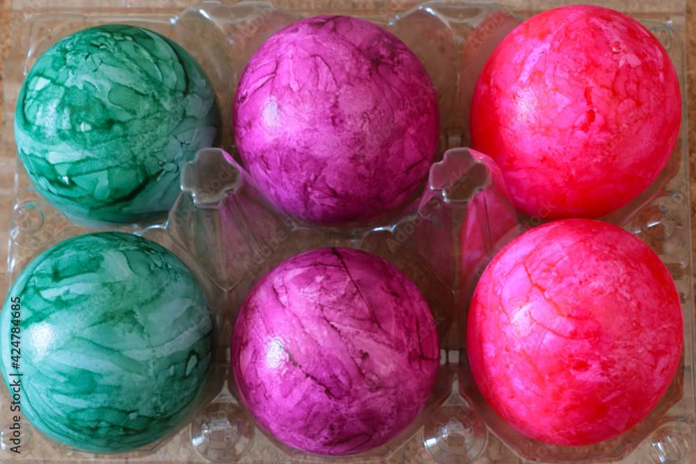 Easter colored eggs in a cardboard box. Easter colored eggs in a cardboard box.