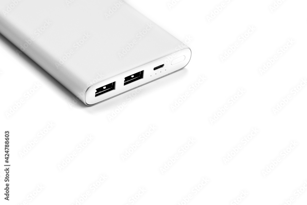 Power bank for charging mobile devices and gadgets on a white background Power bank for charging mobile devices and gadgets on a white background