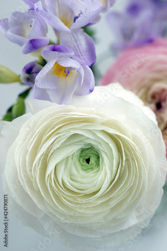 Beautiful bouquet with spring ranunculus and freesias